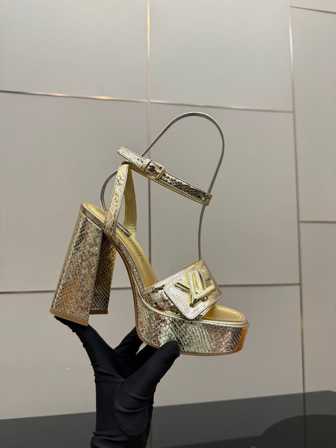 Louis Vuitton ladies metallic heeled sandal with T-strap and platform, front angled view