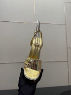 Louis Vuitton ladies metallic heeled sandal, tall heel and ankle strap, back view