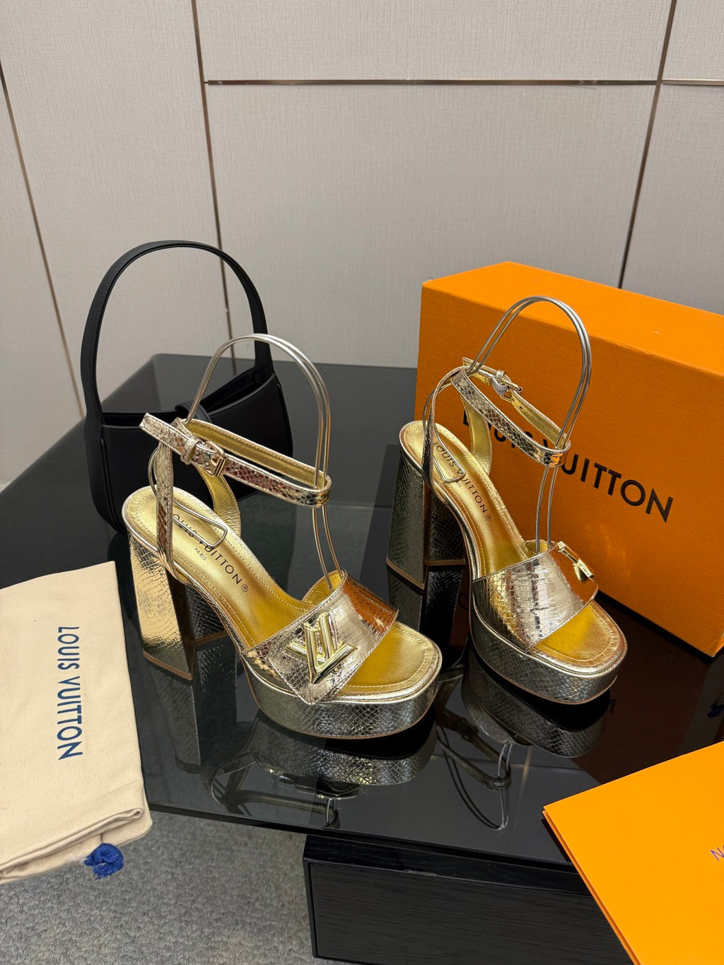 Louis Vuitton ladies metallic platform heeled sandal, side view with T-strap detail
