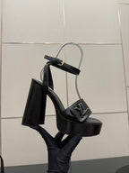 Black high-heel platform sandal with front buckle detail