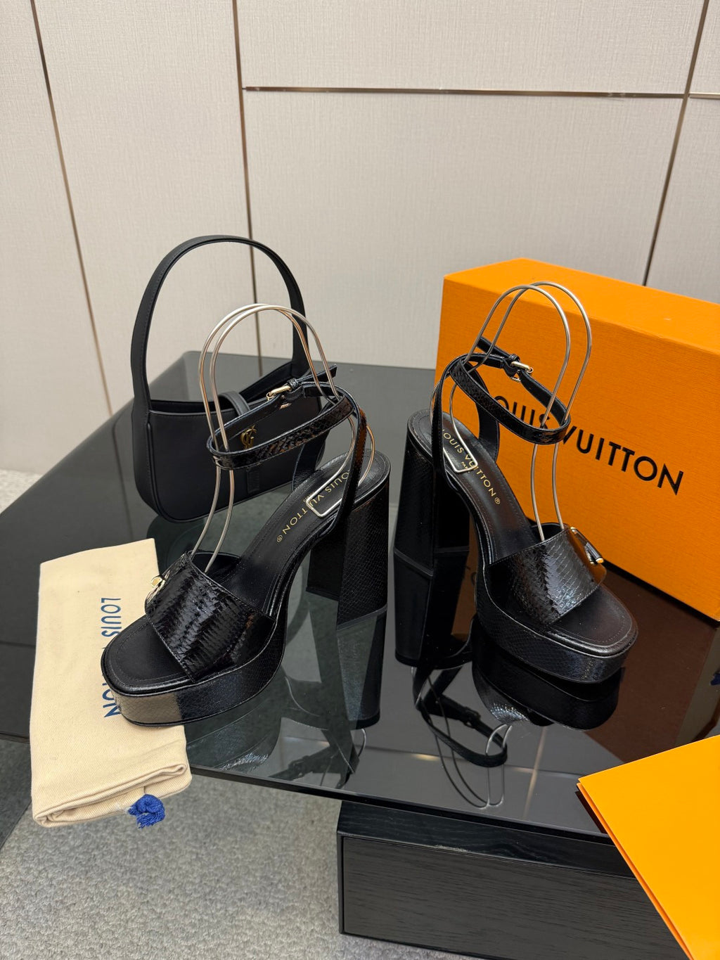 Black platform sandals with high block heels and ankle strap
