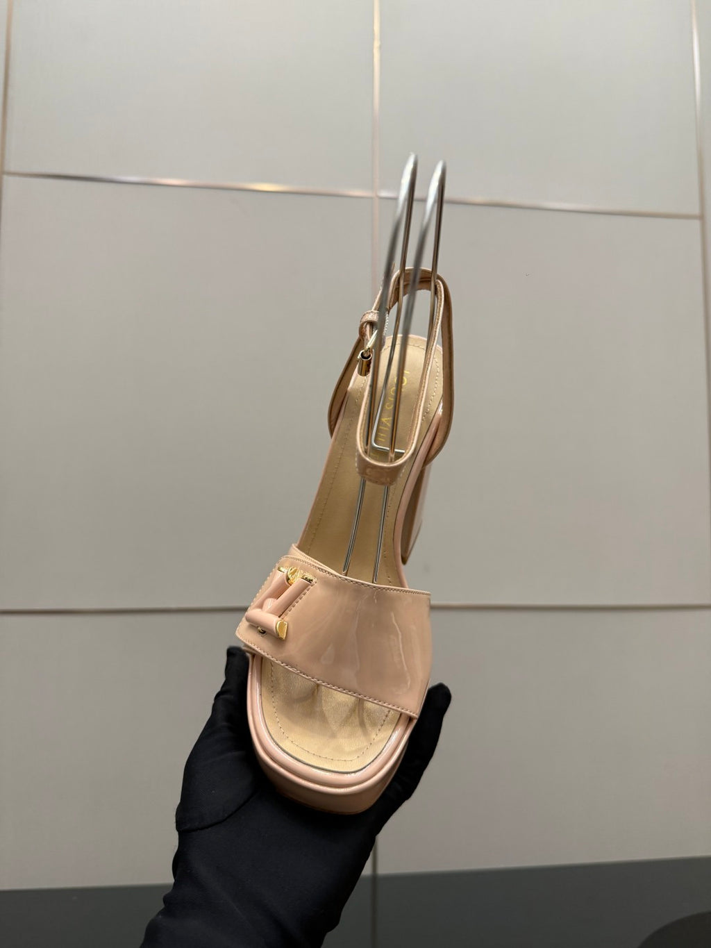 Beige Louis Vuitton heeled sandal side view with slingback strap and block heel