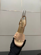 Beige Louis Vuitton heeled sandal side view with slingback strap and block heel