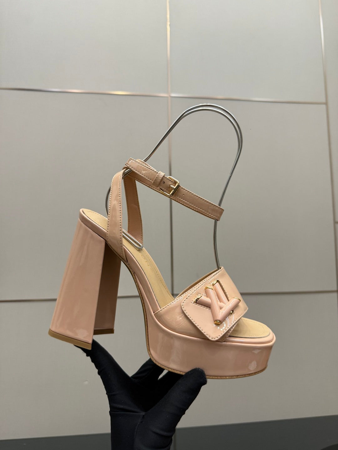 Beige Louis Vuitton heeled sandal with ankle strap and gold-tone buckle detail