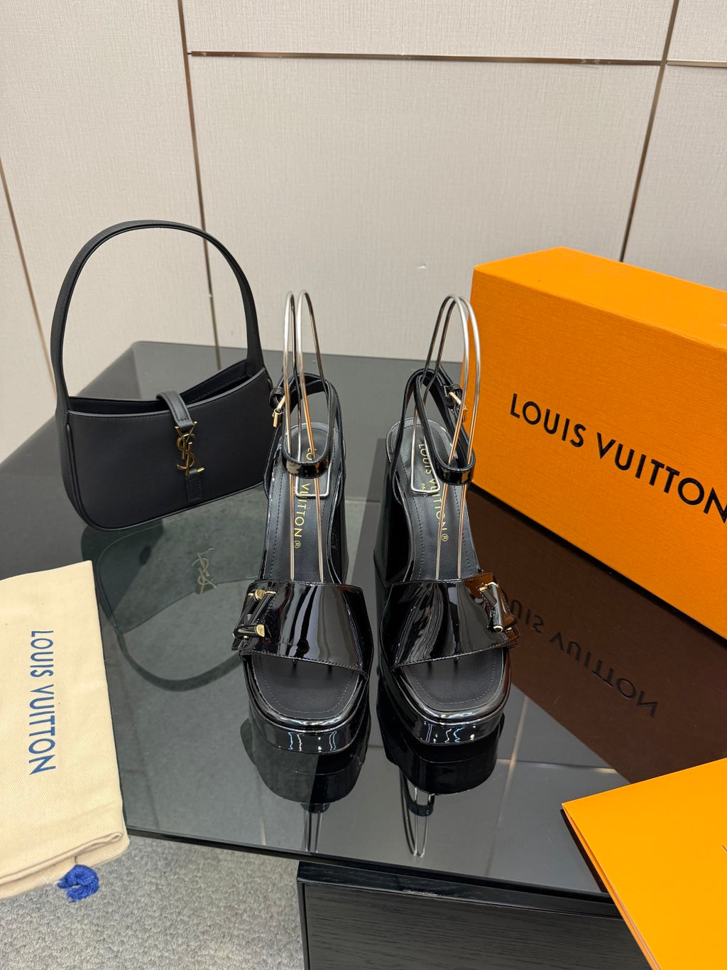 Black patent heeled sandals with ankle strap and buckle detail