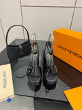 Black patent heeled sandals with ankle strap and buckle detail