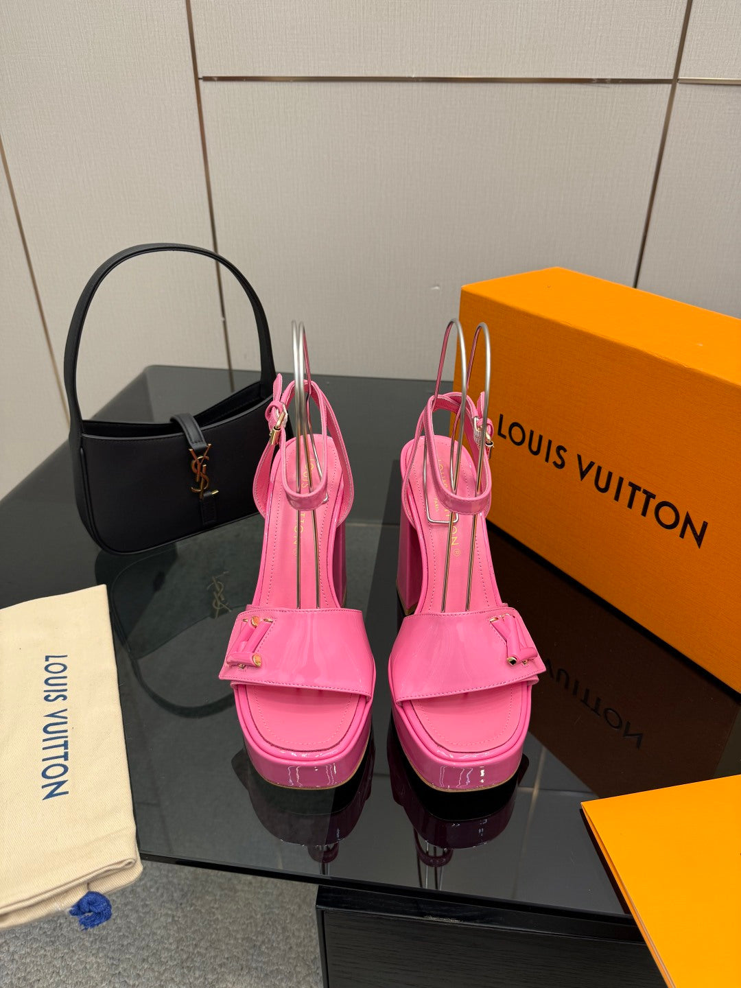 Women’s pink platform heeled sandals with ankle strap and buckle detail