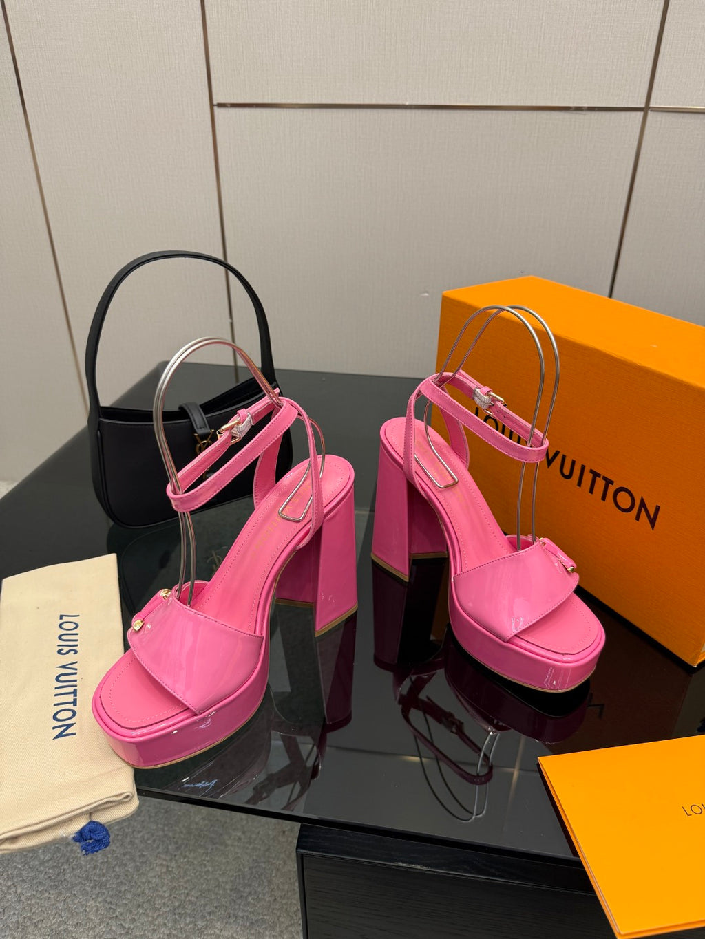 Women’s pink platform heeled sandals with cross strap and buckle closure
