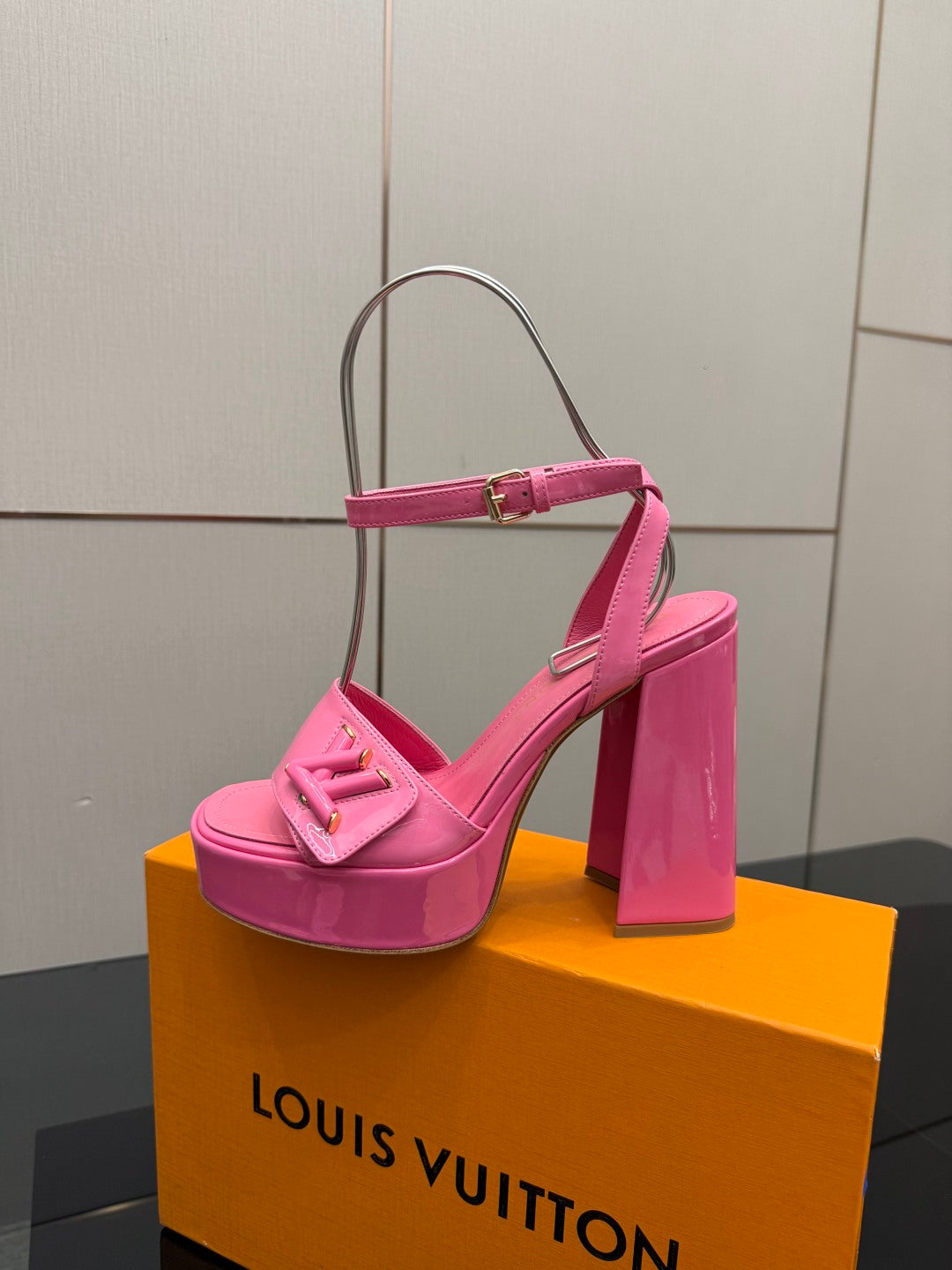 Women’s pink platform heeled sandals viewed from side with thick heel