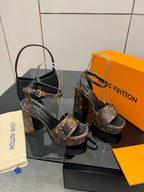 Louis Vuitton women's platform heeled sandals with dark monogram print and black base
