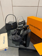 Women’s black platform heeled sandals with slingback strap and V-shaped buckle.