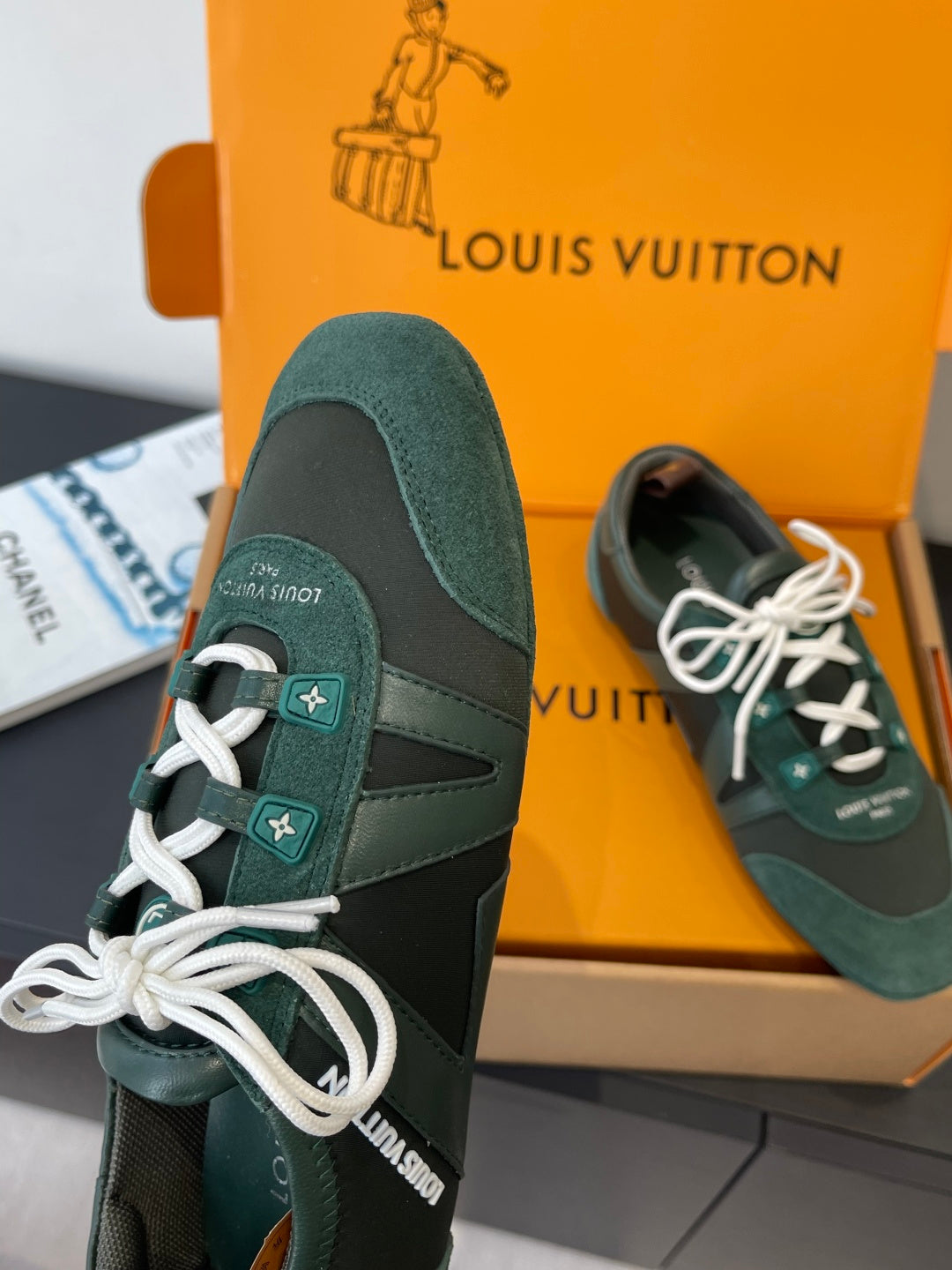 Louis Vuitton unisex sneaker, teal suede upper with white laces and side logo patch