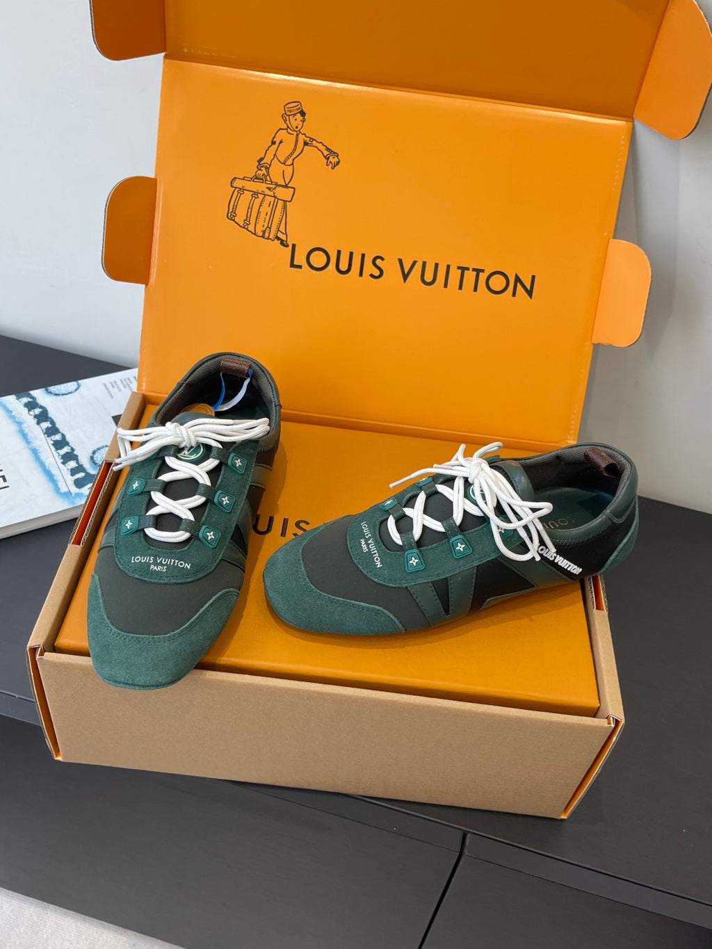 Louis Vuitton unisex sneakers pair in teal with white laces and striped side panels