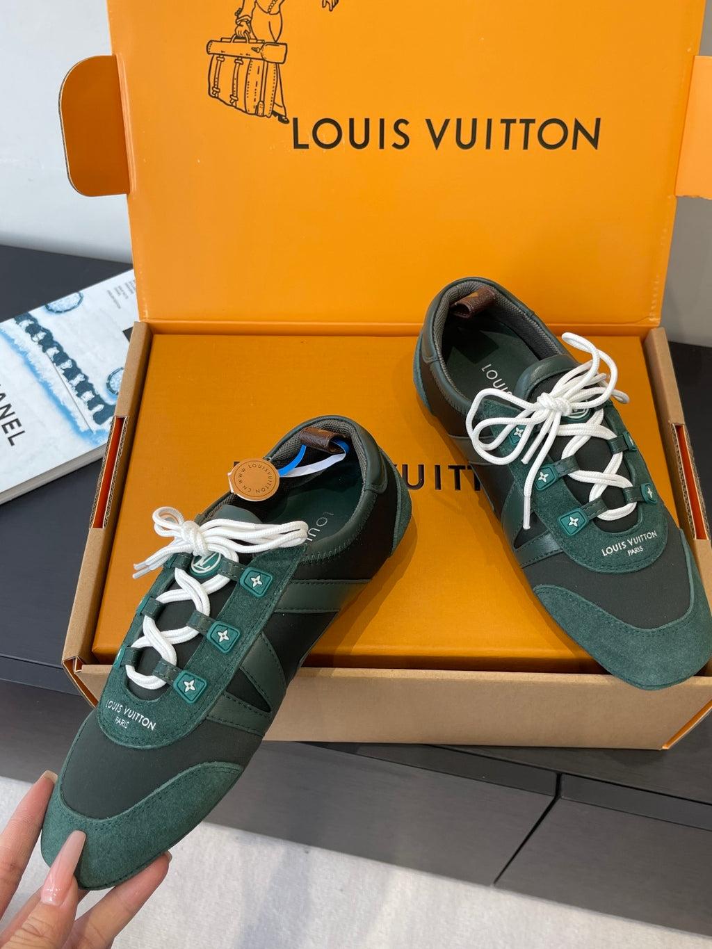 Teal and dark green lace-up sneakers with white laces and side logo patches