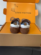 Unisex Louis Vuitton sneakers, rear view showing brown suede heels and white trim