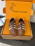 Brown lace-up sneakers with white panels and beaded trim details