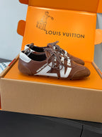 Brown lace-up sneakers with white V panels and braided laces