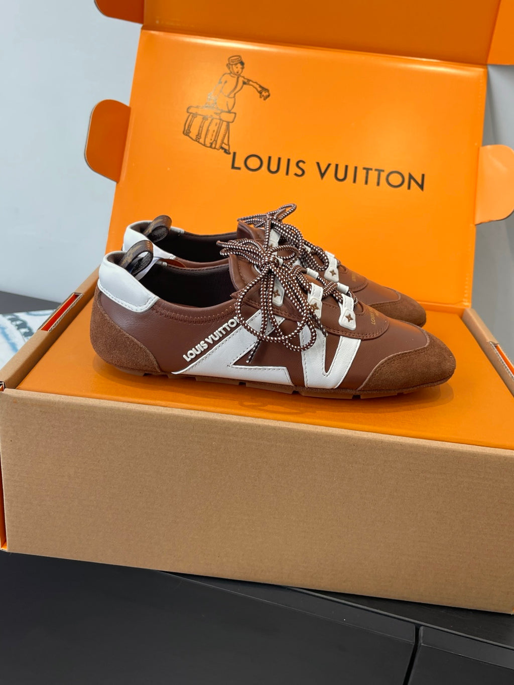 Unisex Louis Vuitton sneakers, dark brown with white V stripe and patterned laces