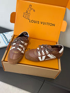 Brown and white lace-up sneakers in a box, with patterned side panels