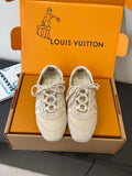 Louis Vuitton lace-up sneakers, light beige canvas with star emblems, in box
