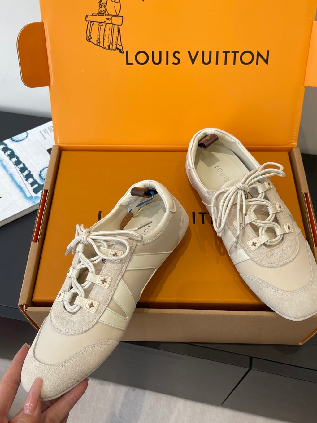 Beige Louis Vuitton unisex lace-up sneakers with side logos and star details in box