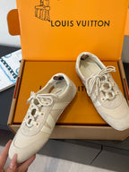 Louis Vuitton lace-up sneakers, light beige panels, side star emblem details, in box