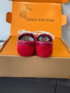 Louis Vuitton unisex red sneakers with white laces, backs facing in open box