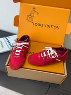 Louis Vuitton unisex red sneakers with white laces, pair in open orange shoebox