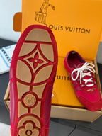 Louis Vuitton unisex red sneaker sole with tan graphic, white laces visible