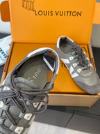 Gray and white Louis Vuitton lace-up sneaker, close-up of tongue and lacing