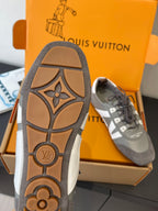 Gray Louis Vuitton sneaker outsole with tan pattern and tread detail, side view