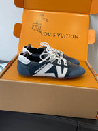 Louis Vuitton unisex sneakers with white laces, navy panels and light blue side strip