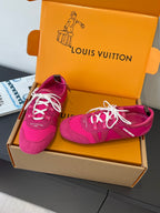 Unisex bright pink sneakers with white laces, side stripes, and low sole