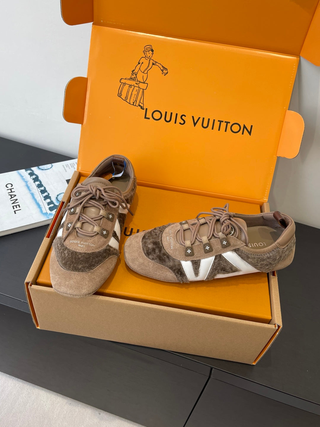 Pair of gray suede lace-up sneakers with white side stripe and star emblems