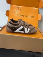 Unisex Louis Vuitton low-top shoes with gray suede, white side stripe, and lace-up front