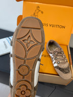 Unisex Louis Vuitton shoe outsole with LV-style logo and patterned traction on tan rubber