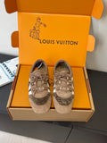 Gray suede lace-up sneakers with white side stripe and star logo accents