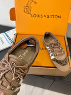 Gray suede lace-up sneakers with white stripe and stitched toe panel
