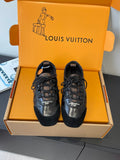 Black leather lace-up sneakers with embossed logo on sides