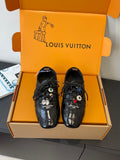 Louis Vuitton unisex black lace-up sneakers with decorative charms and logo print