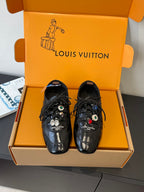 Louis Vuitton unisex black lace-up sneakers with decorative charms and logo print