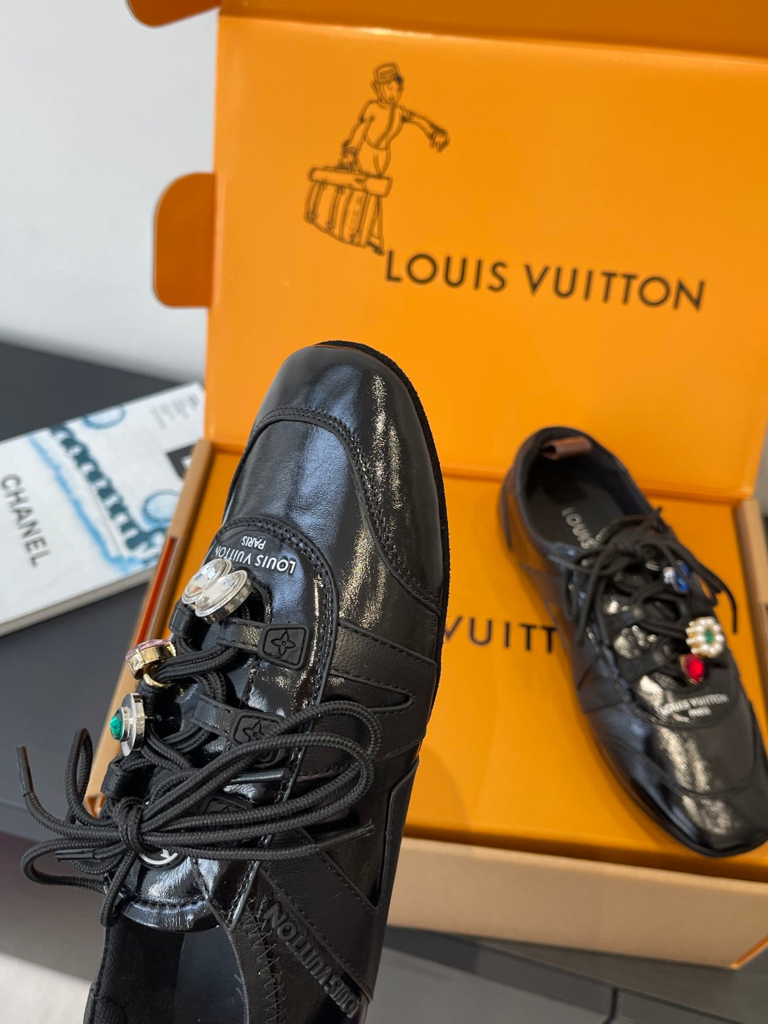 Louis Vuitton unisex black lace-up sneaker side view with textured leather