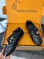 Louis Vuitton unisex black lace-up sneakers with jewel-like charms, close angle
