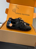 Louis Vuitton unisex black lace-up sneaker in open box, side view