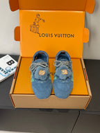 Unisex blue suede sneakers with lace-up ties and bear-face patch on fuzzy tongue