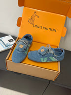 Unisex blue suede sneakers with bear-face patches and green stripe, side view