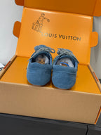 Unisex blue suede sneakers with lace-up bows and bear-face patches, pair view
