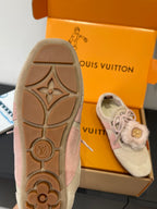 Light beige sneaker outsole and side view with fur trim, in shoe box