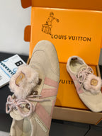 Beige suede sneaker with pink laces and fur cuff detail, shown with box