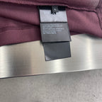 Prada size tag and care label on burgundy polo shirt